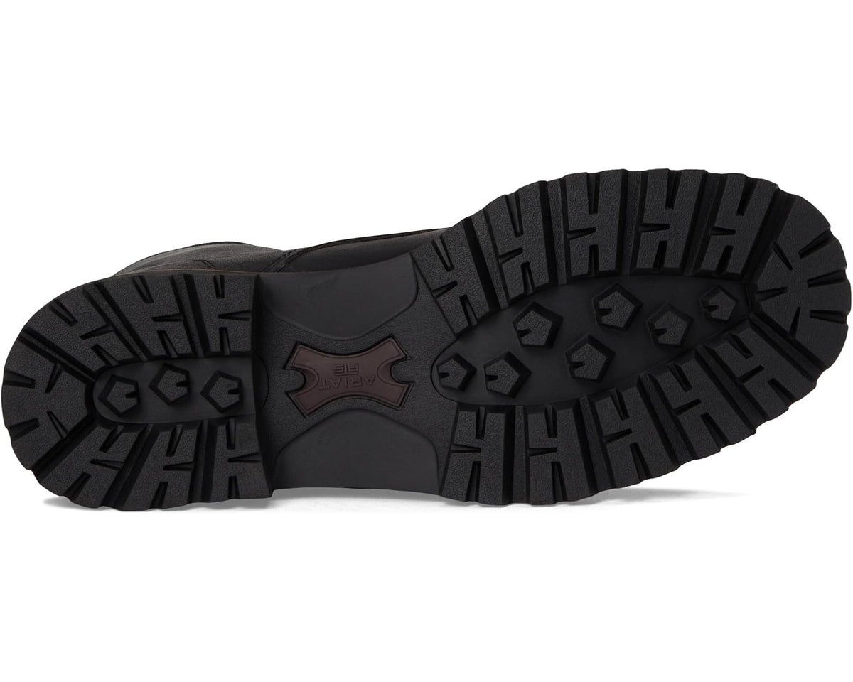 Black boot outsole with chunky lug tread and dark logo patch