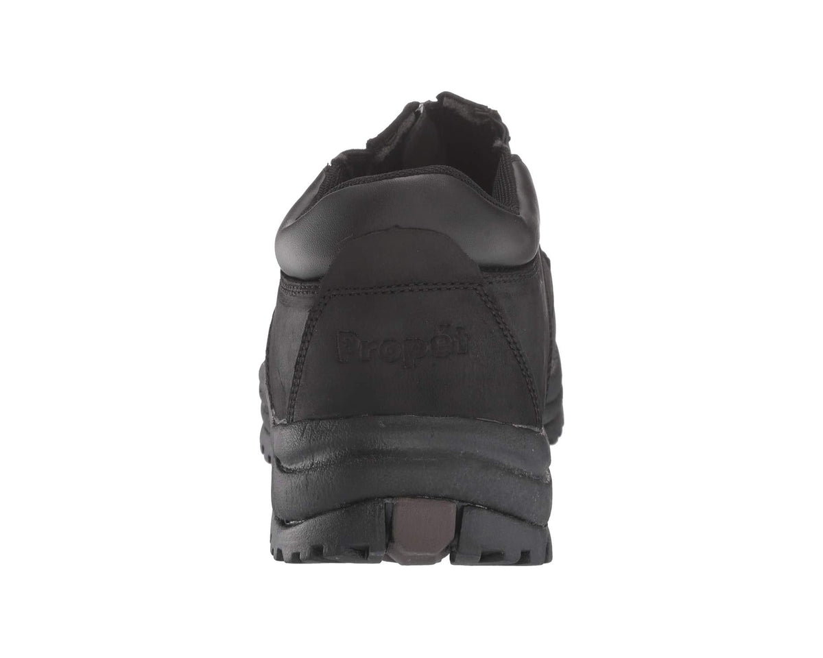 Black back view of ankle zip boot with cushioned heel and tread sole