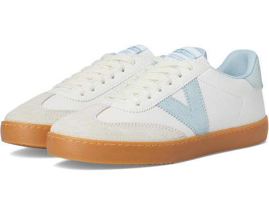 Unisex low-top sneakers in white with light blue suede accents and tan gum sole.