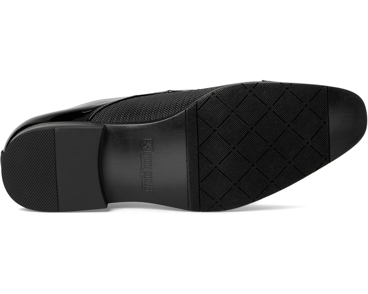 Black oxford shoe outsole and textured upper with diamond tread
