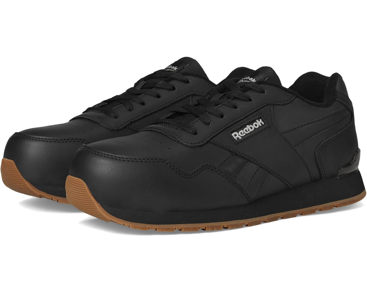Black Reebok work shoe with lace-up closure and low-profile rubber sole