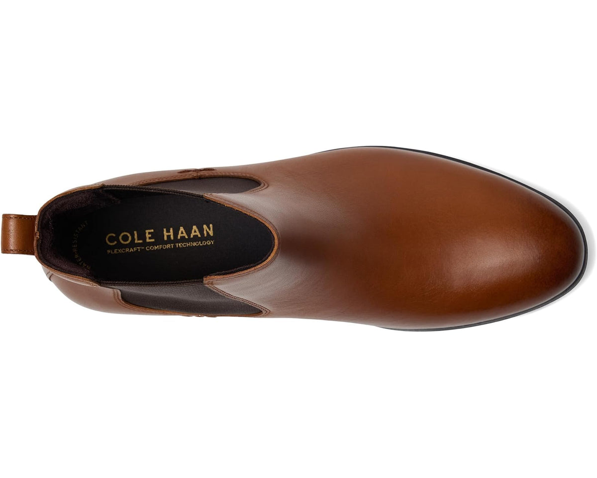 Brown leather Chelsea boot with elastic gore and visible interior lining and logo