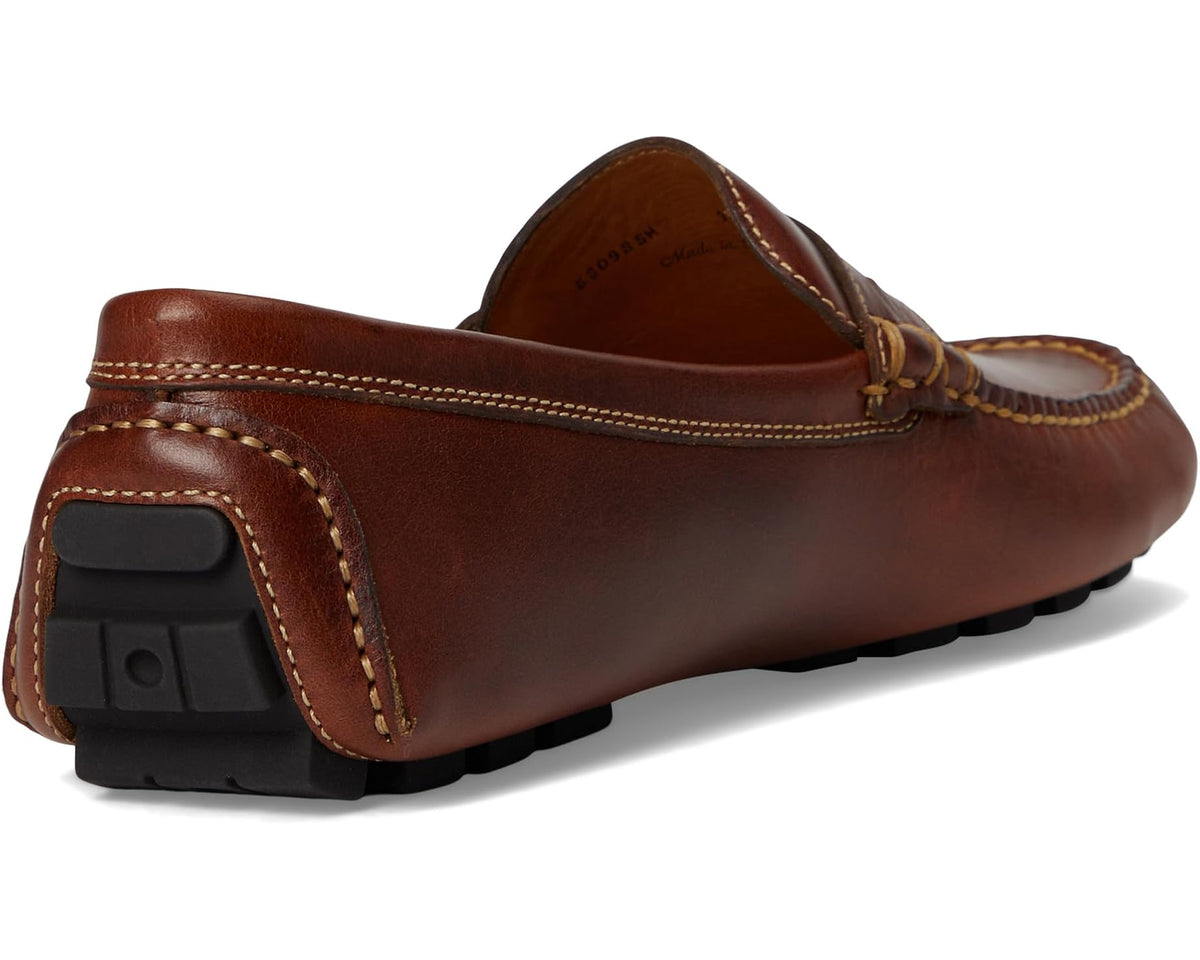 Cigar brown penny loafer from heel side with stitched apron and rubber sole