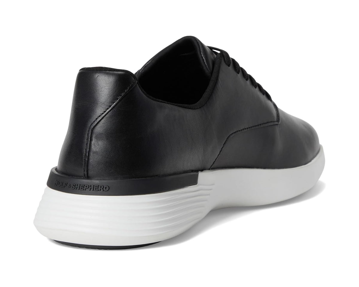 Black leather derby sneaker heel with white sole and padded collar