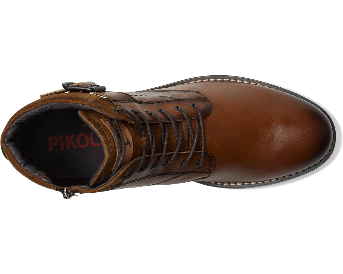 Brown leather lace-up ankle boot, black lining, metal eyelets and contrast stitching