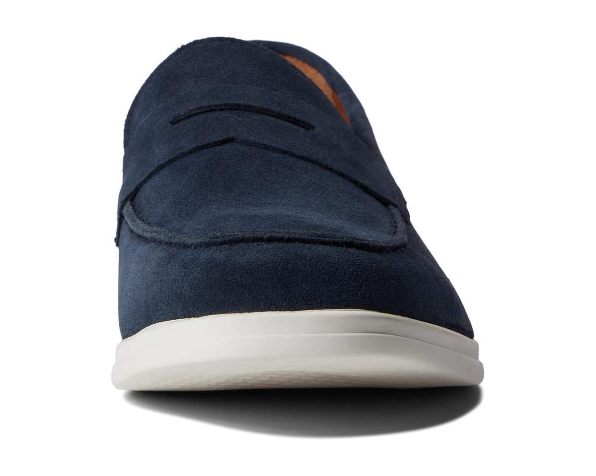 Navy suede loafer with moc-toe stitching and moccasin-style apron strap