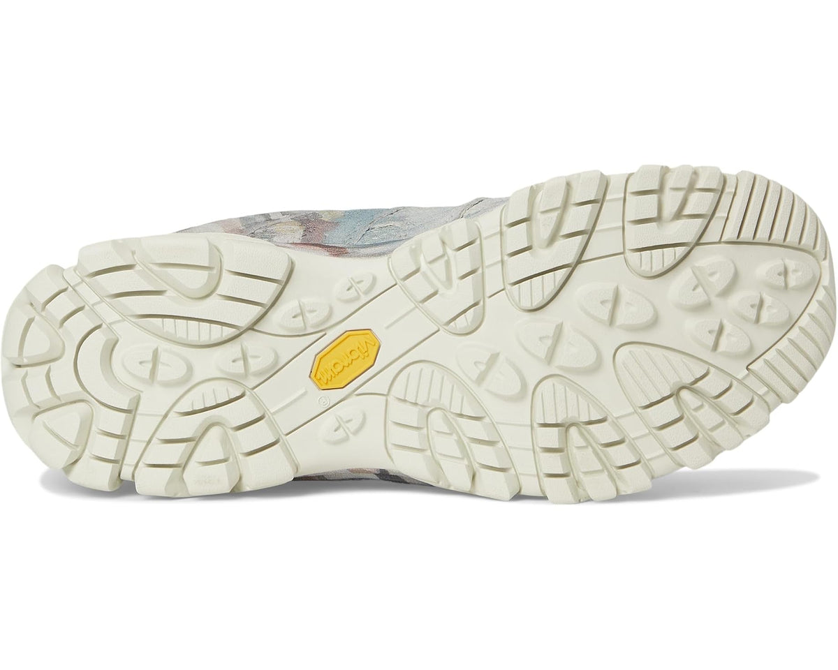Light ecru rubber outsole with rugged tread and yellow logo badge