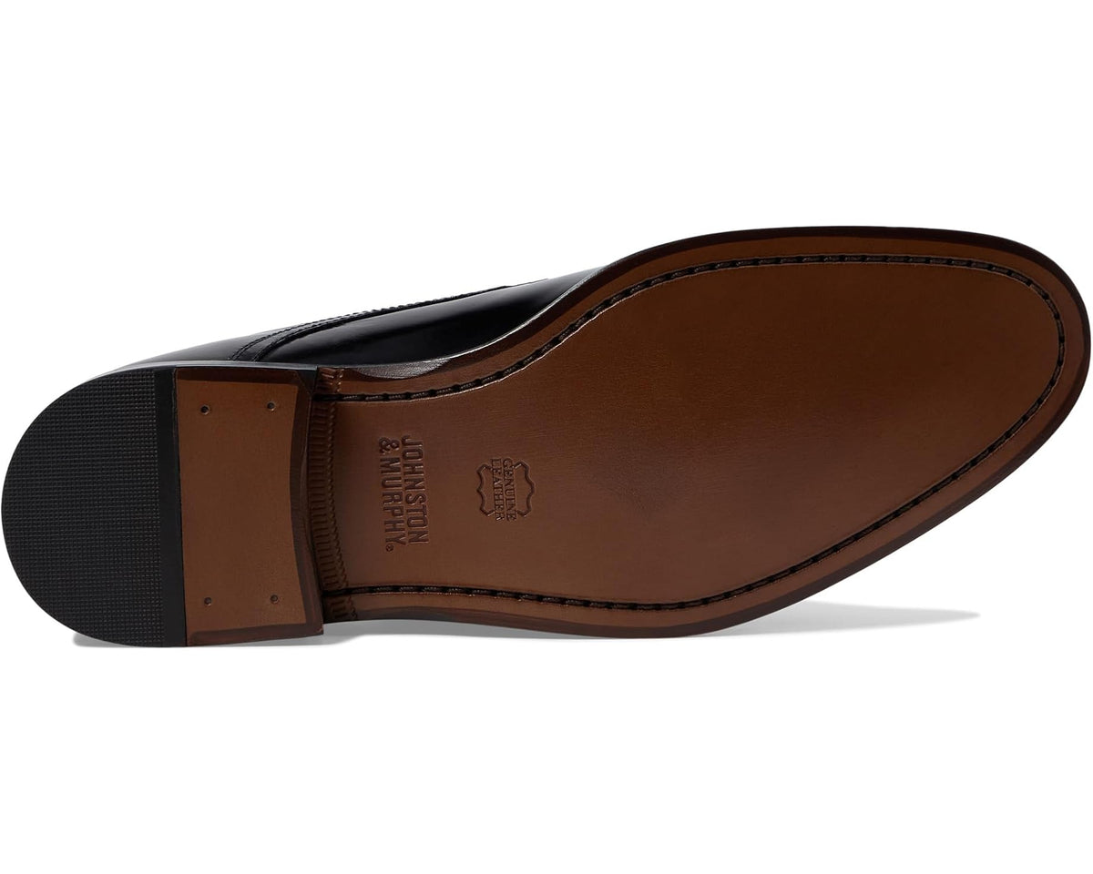 Black Oxford shoe outsole with textured rubber sole and molded heel insert