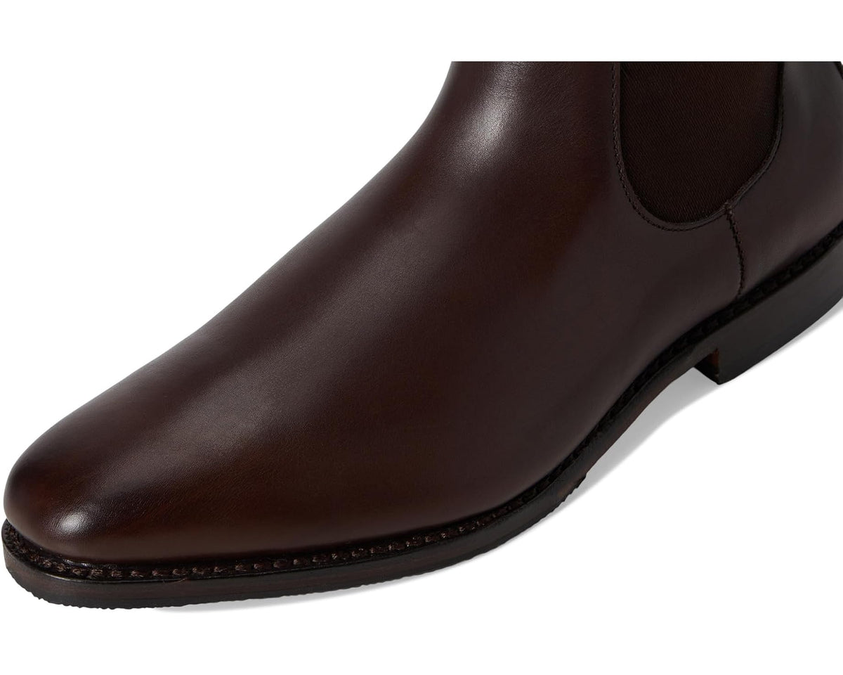 Close-up of espresso leather Chelsea boot with stitched sole edge