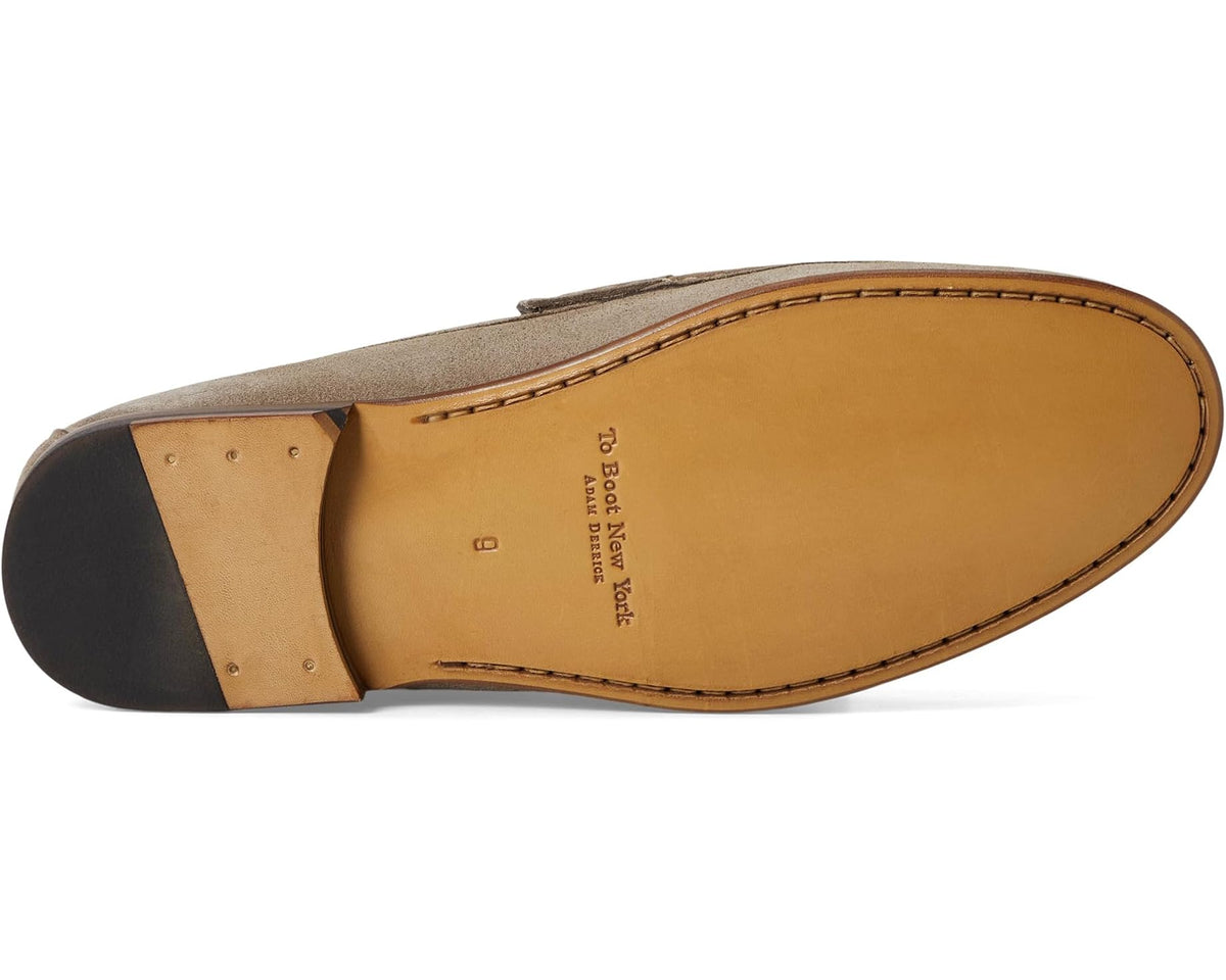 Taupe suede loafer outsole and leather insole with stitched edge
