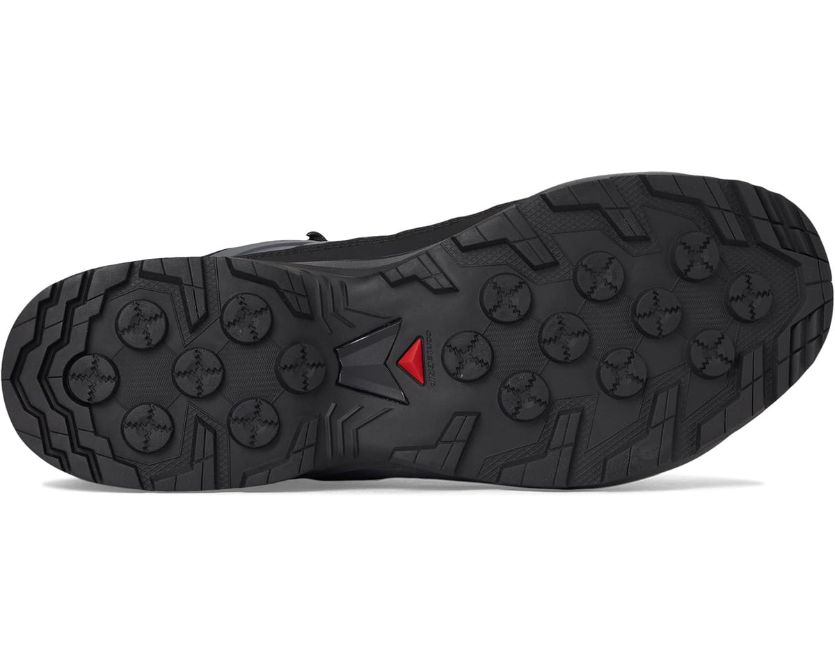 Men's Salomon hiking boot outsole with deep tread and red arrow detail