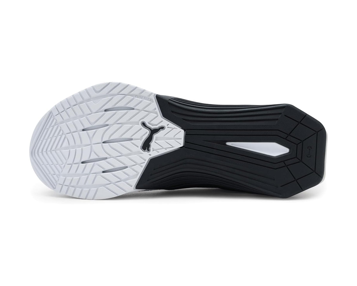 Cross training shoe outsole with black traction pods and light gray rubber tread.