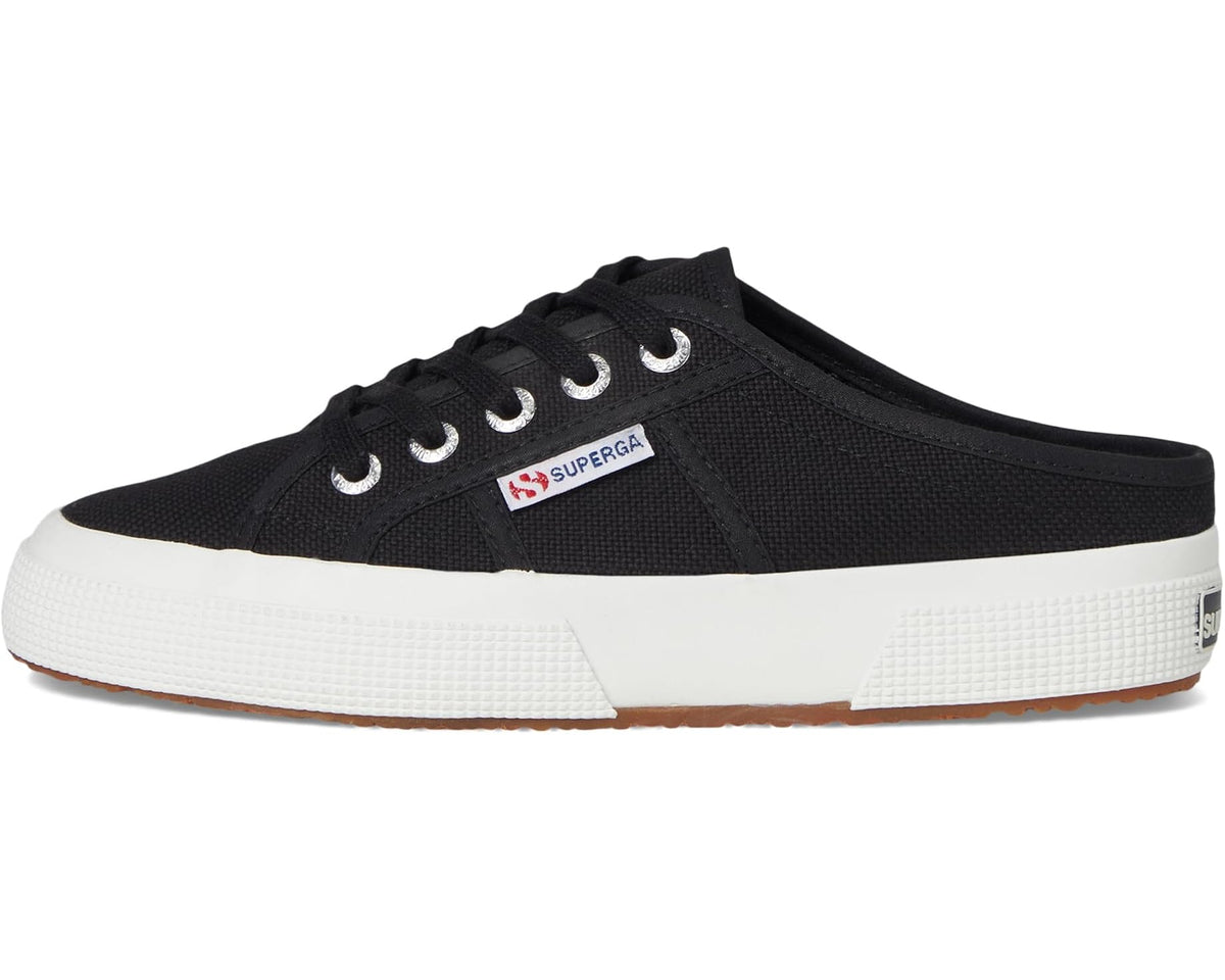 Black canvas mule sneakers with lace-up closure, white sole, and Superga patch.