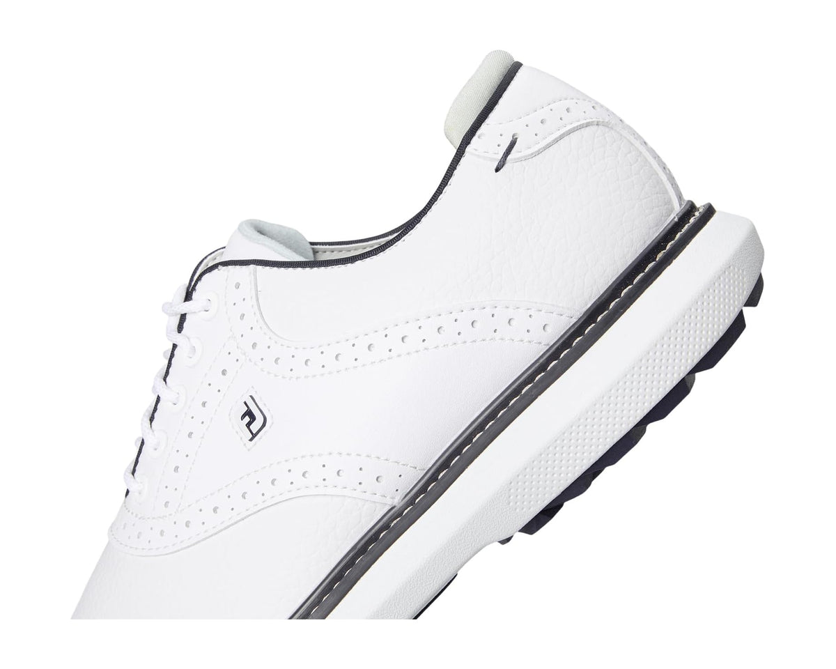 FootJoy spikeless golf shoe side profile in white with navy piping detail