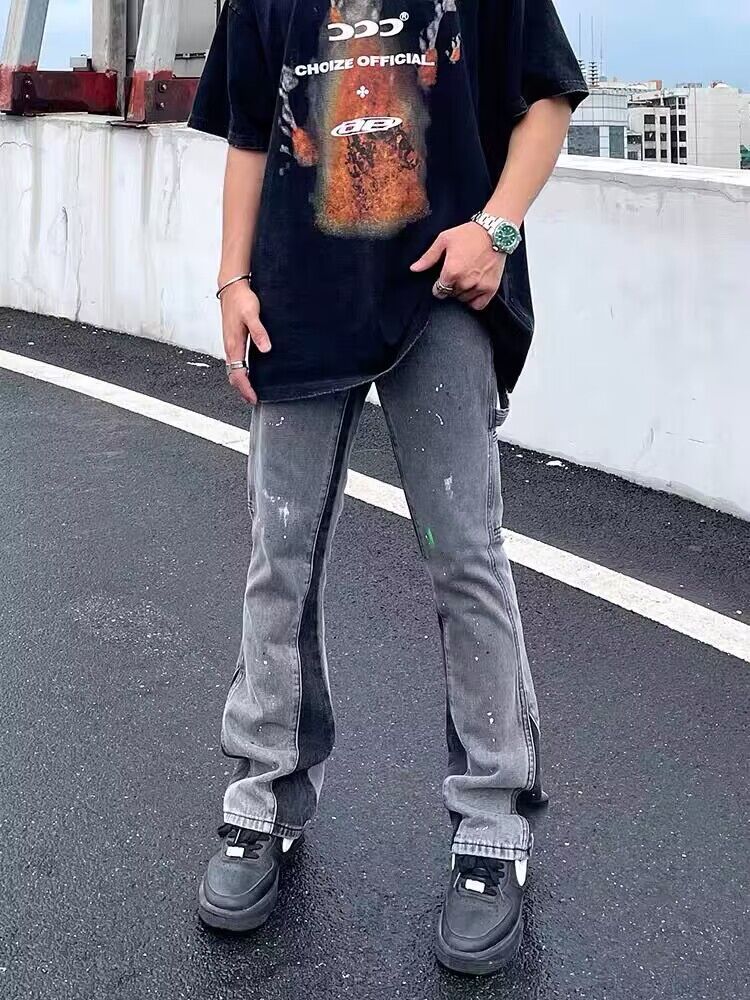 Gray denim jeans with scattered paint specks, relaxed straight fit
