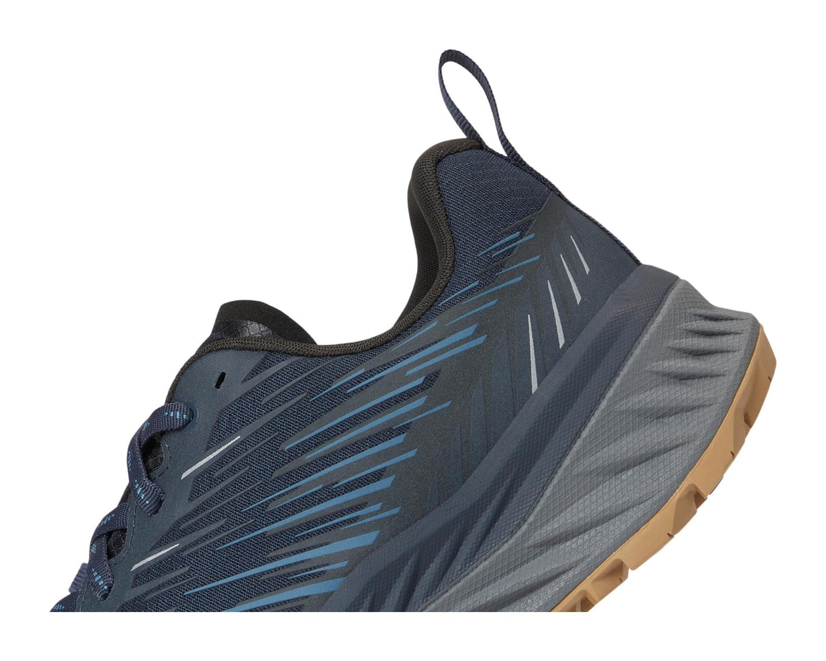 Men's dark navy side view trail shoe with blue graphic detailing and mesh