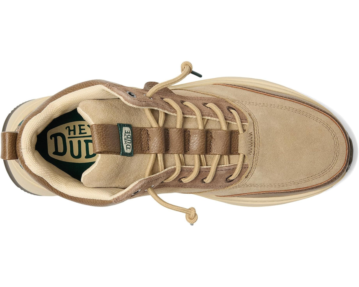 Tan and brown lace-up boot with padded tongue, interior lining, and lace stay tabs