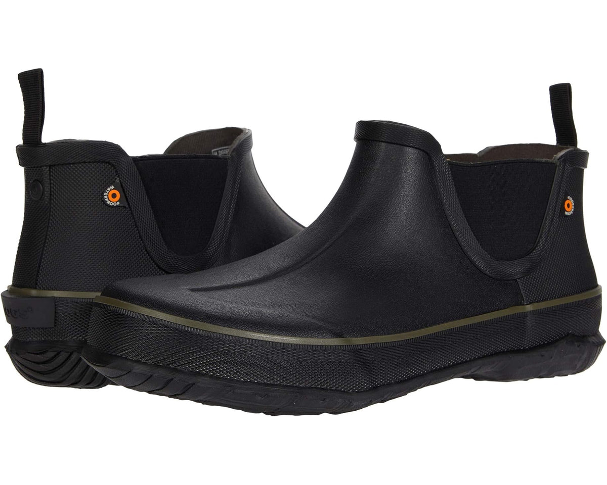Black slip-on rubber boots with side elastic panels, pull tab, and thick tread sole