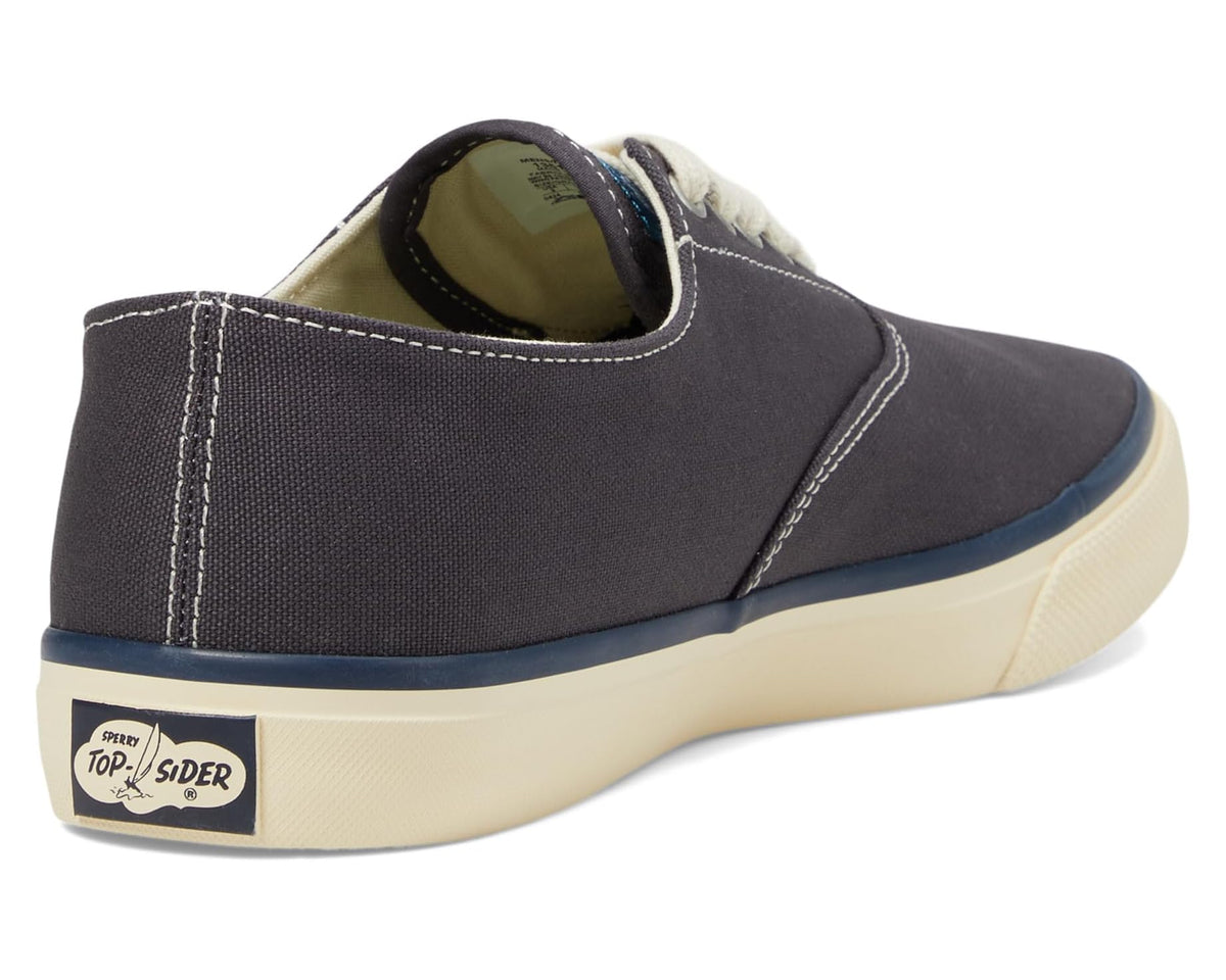 Navy canvas sneaker heel with cream sidewall and Sperry Top-Sider logo patch