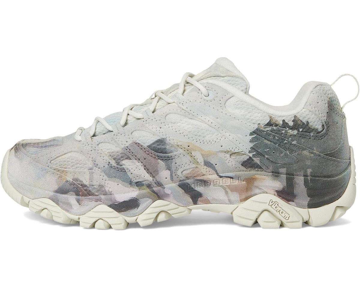 Light ecru lace-up hiking shoe with multicolor camouflage overlay and chunky sole