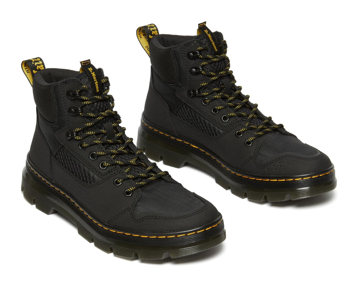 Unisex black lace-up Dr. Martens Rilla ankle boots with yellow eyelets and stitching