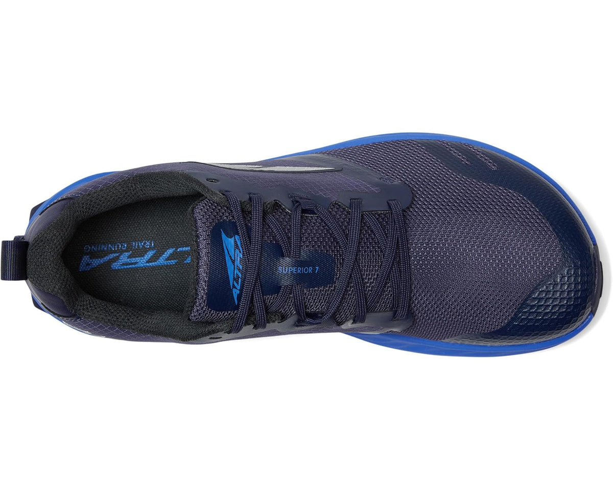 Dark blue mesh running shoe with padded collar and lace-up closure, showing insole.