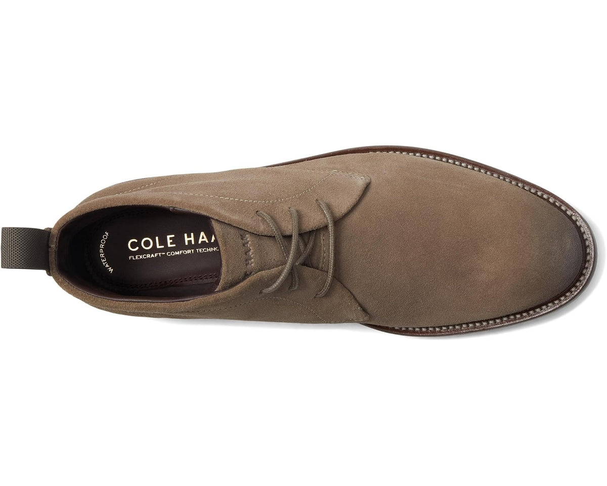 Men's suede chukka boot, side view with lace-up closure and cushioned heel lining