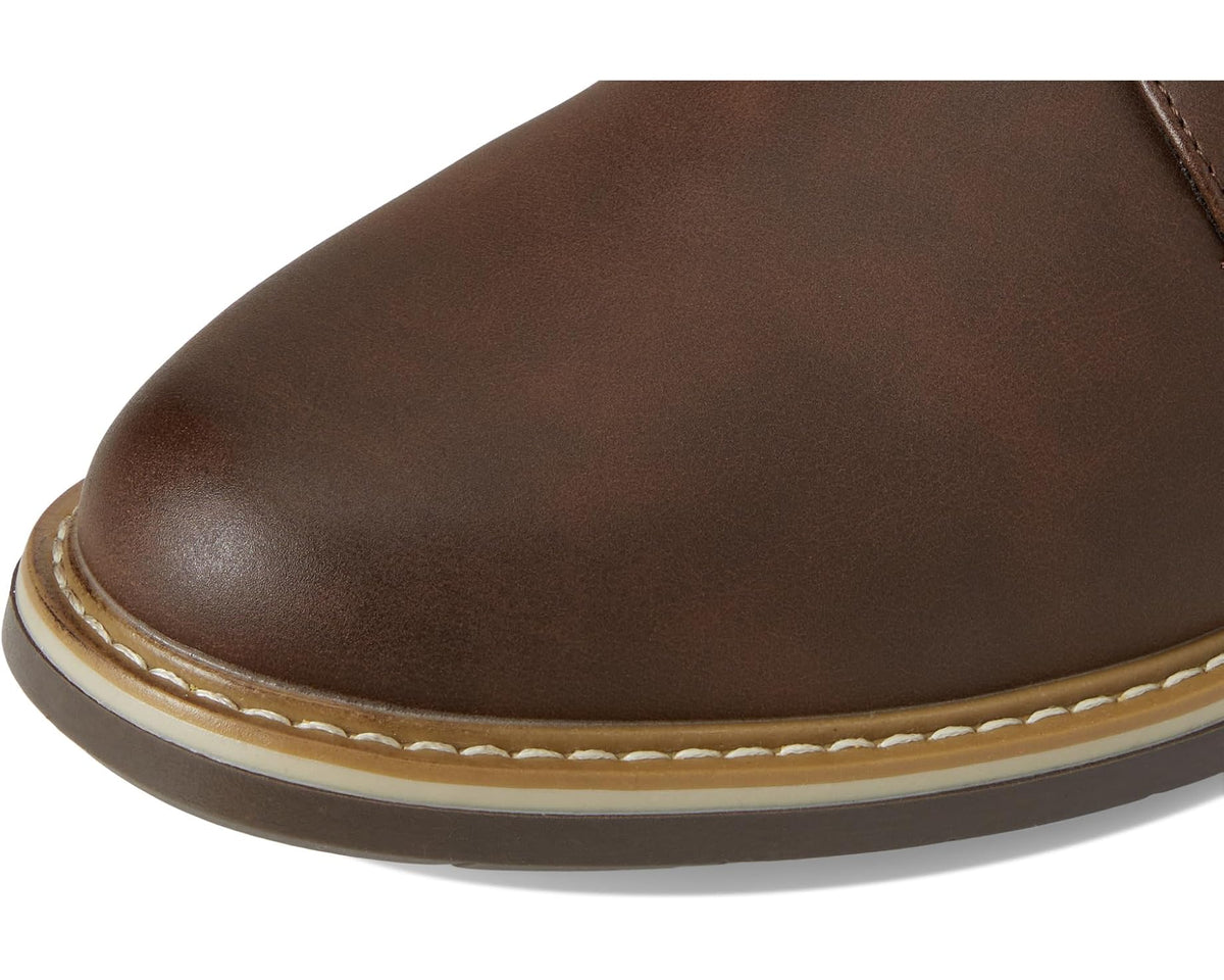 Close-up of dark brown leather oxford shoe toe with contrast edge stitching