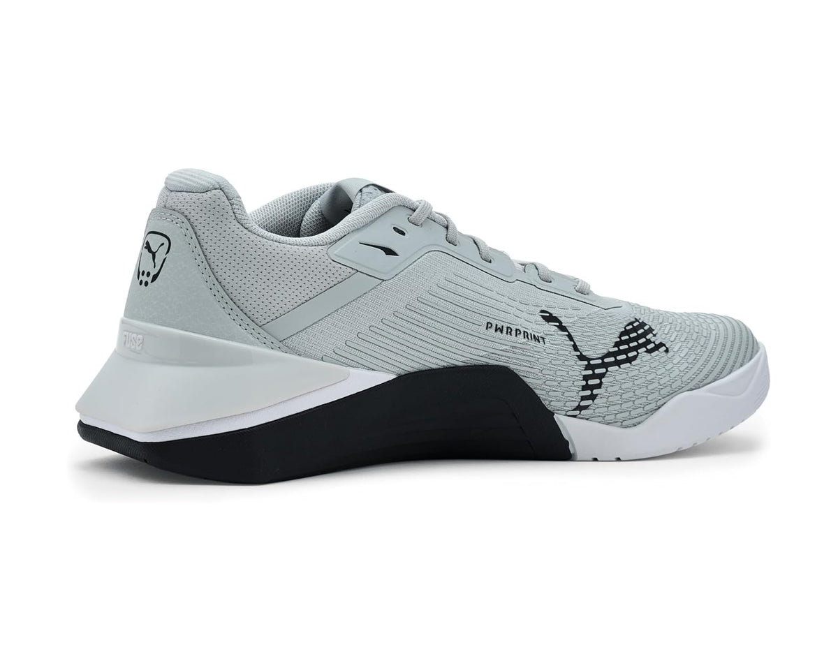 Light gray cross training shoes with black midsole panel and textured side.