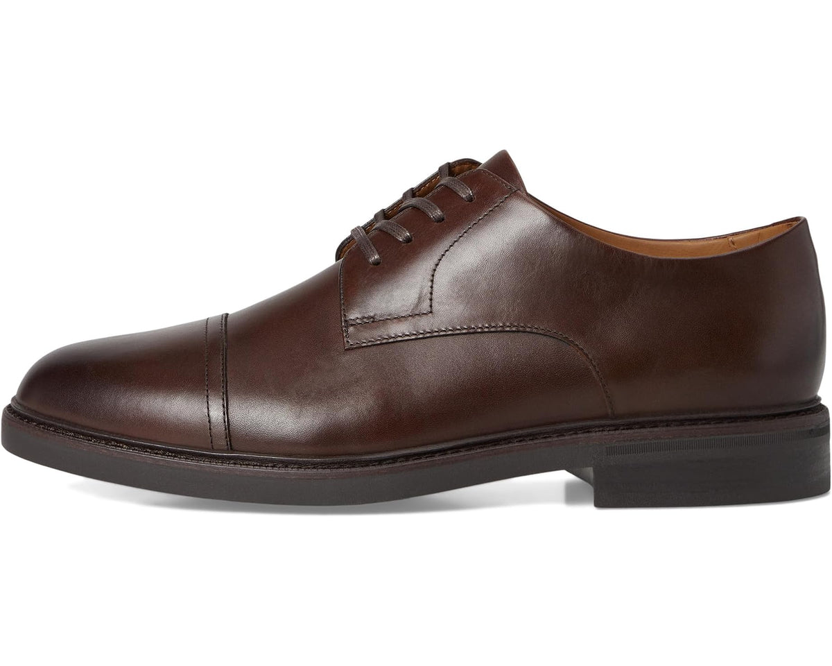 Brown leather lace-up oxford with cap toe, stitched seams, and dark sole.