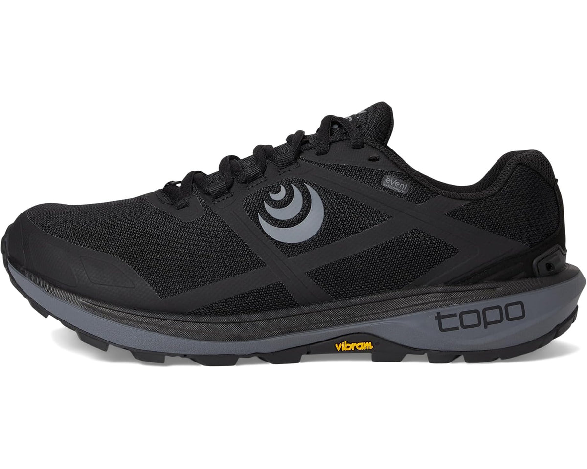 Black trail running shoe with lace-up mesh, side swirl logo, and cushioned sole