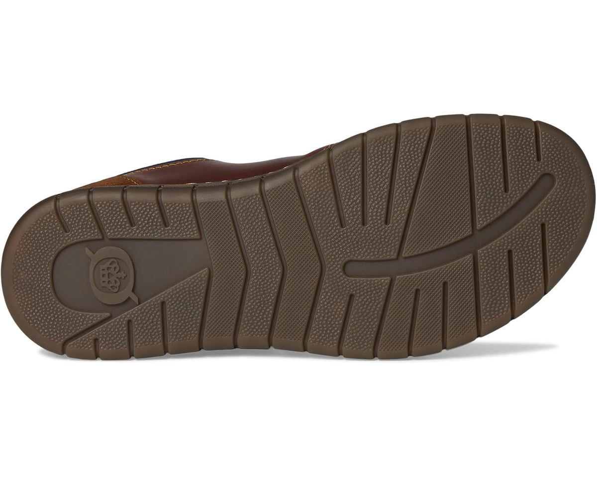 Born men's lace-up shoe outsole with textured rubber tread and dark brown upper edge