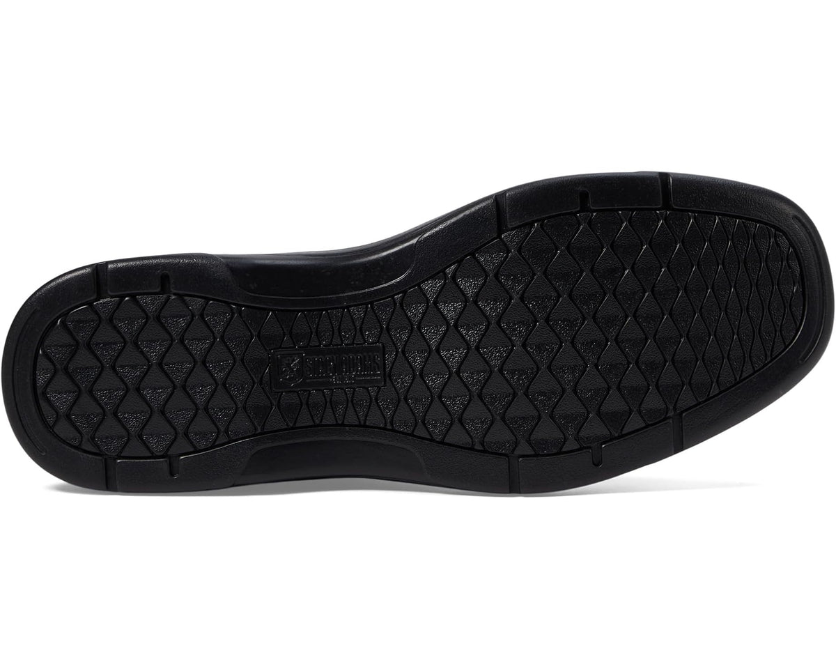 White sandal outsole with deep traction tread and textured rubber pattern