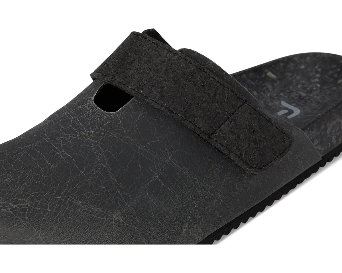 Unisex dark gray clog side view with strap detail and small opening