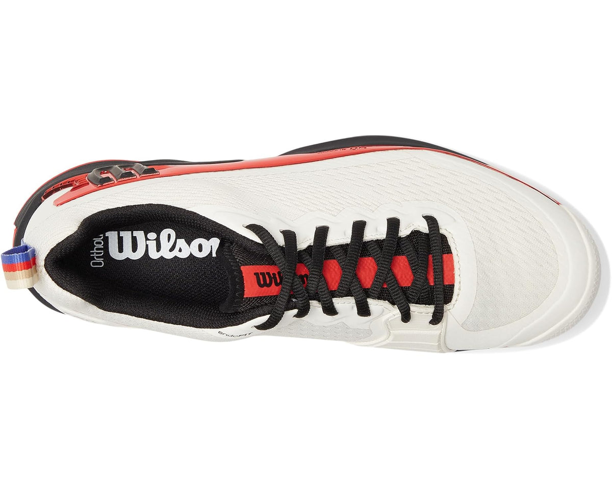 Men's white tennis shoe side view with Wilson logo and black red detailing