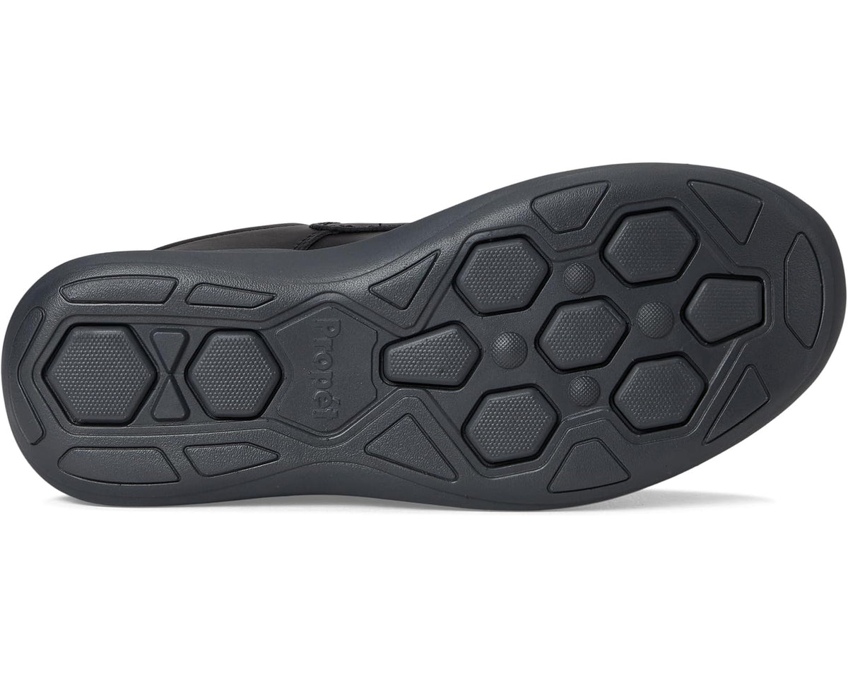 Men's black Propet shoe outsole tread with hex and geometric grip pattern