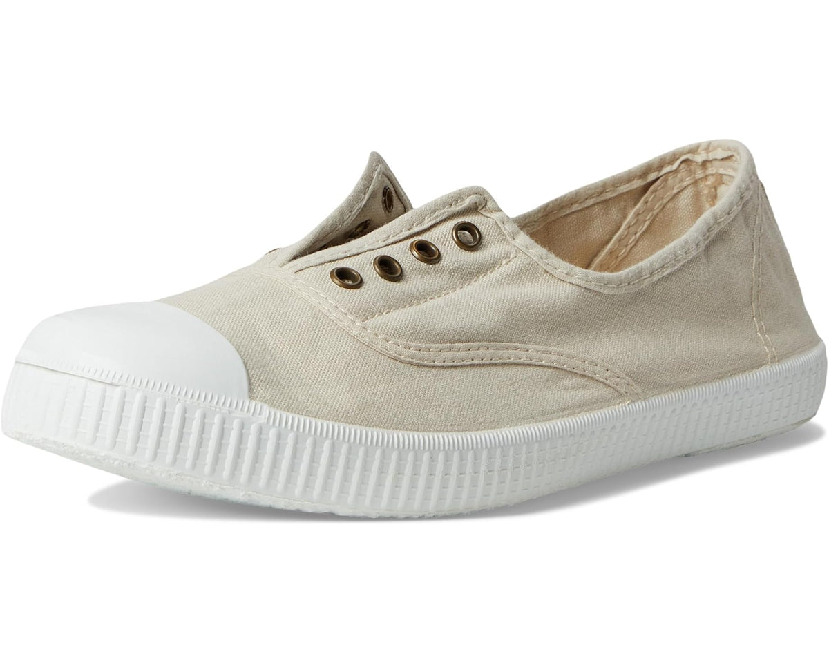 Women's beige canvas sneakers with low profile rubber sole and eyelets