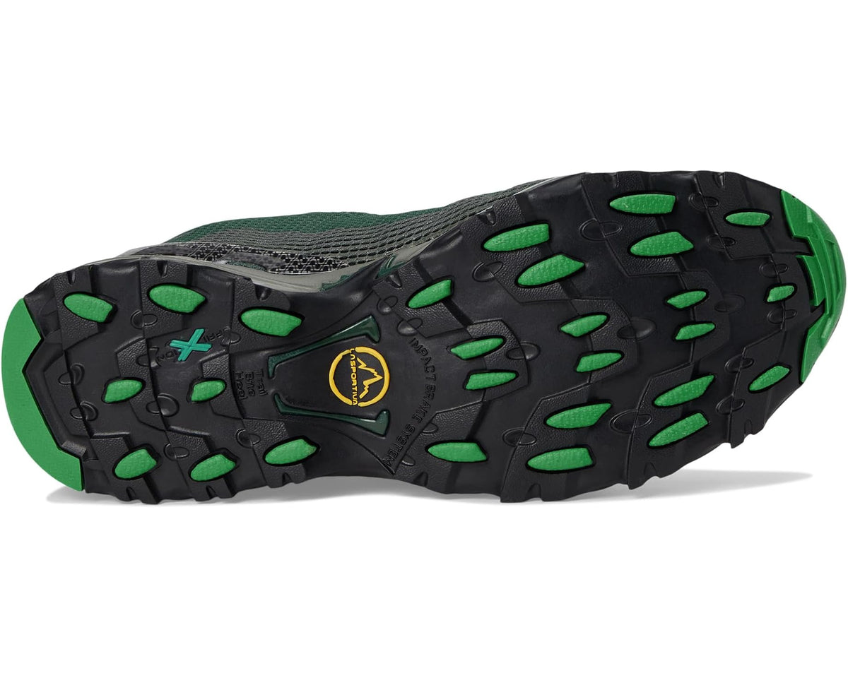 Men's trail shoe outsole with green traction lugs and dark rubber tread
