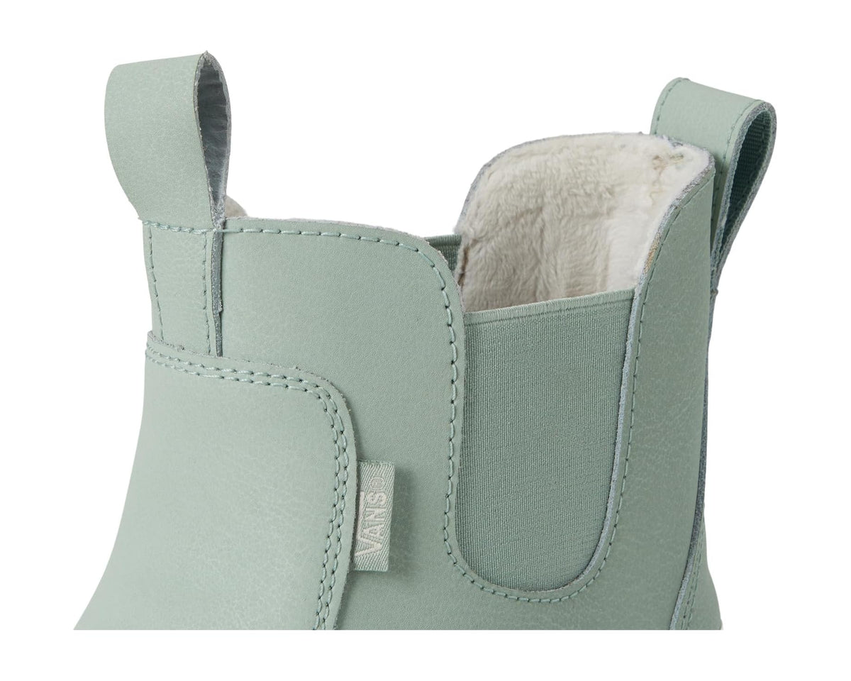 Close-up of light green-gray Chelsea boot upper with elastic gore and faux-fur lining