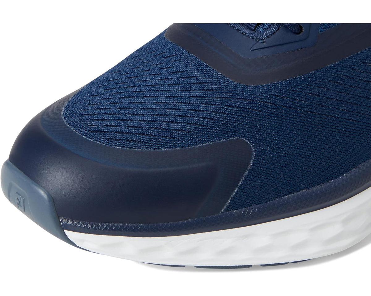 Women's FootJoy athletic sneaker toe and sole detail in navy with white midsole