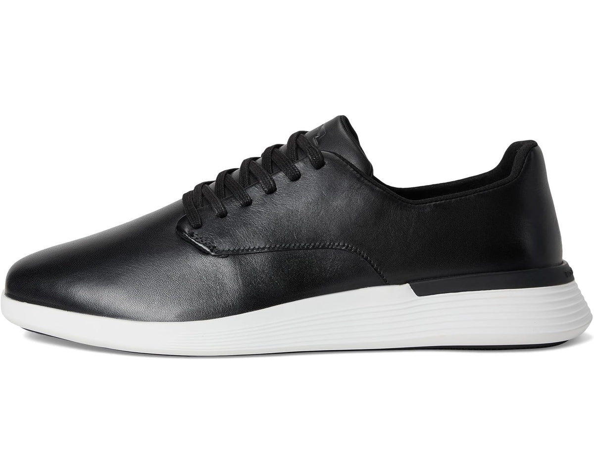 Black leather lace-up derby sneaker with white rubber sole and low profile