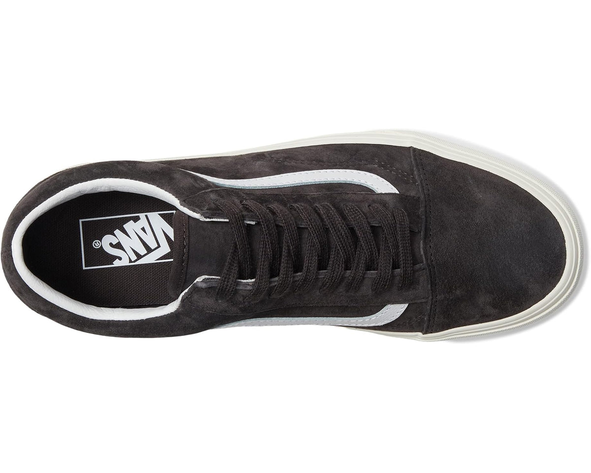 Vans low-top sneakers with lace-up front, dark suede upper, and white side stripe