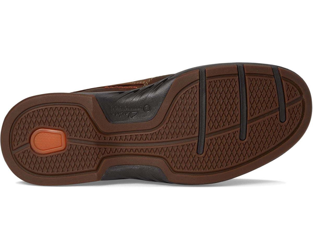 Men's brown leather slip-on loafer outsole view with textured traction
