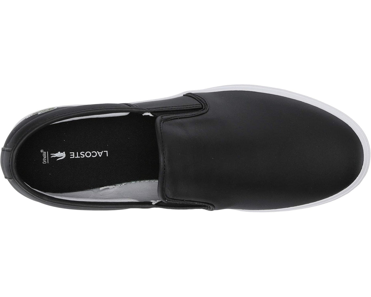 Black slip-on sneaker showing inner logo label and cushioned lining, white sole