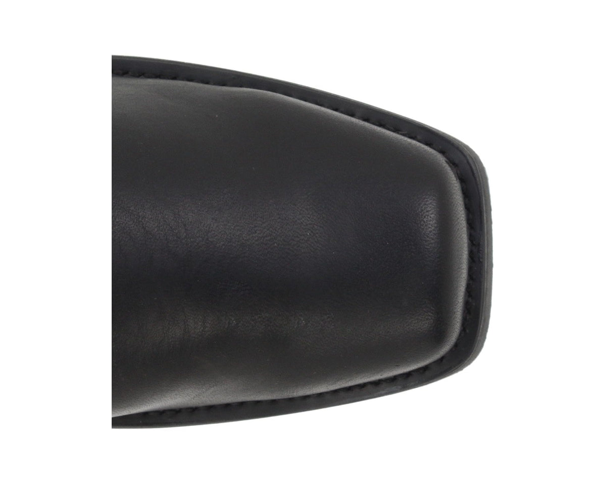 Close-up of black boot side with smooth leather texture and stitched edge.