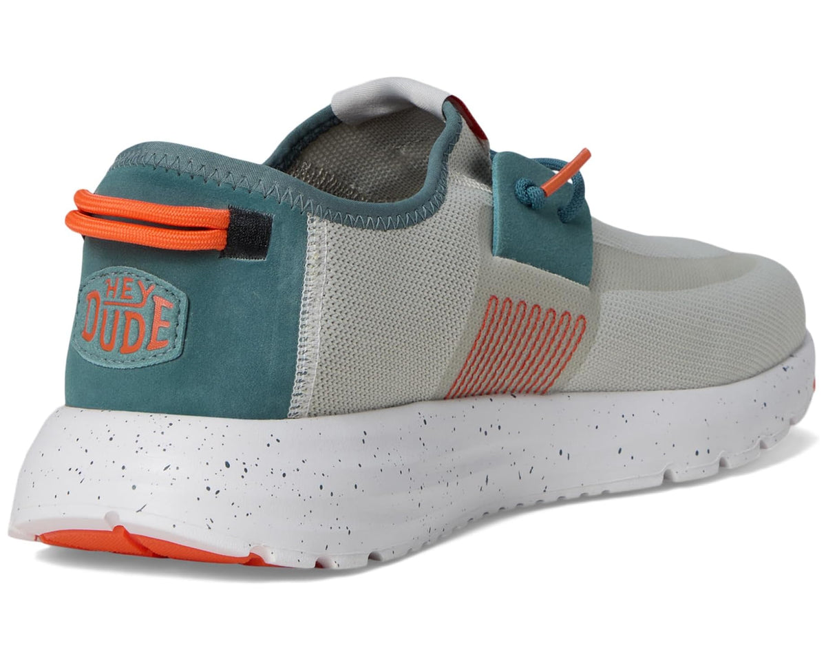 Men's Hey Dude Sirocco M active sneakers, heel view with teal sock and orange pull tab