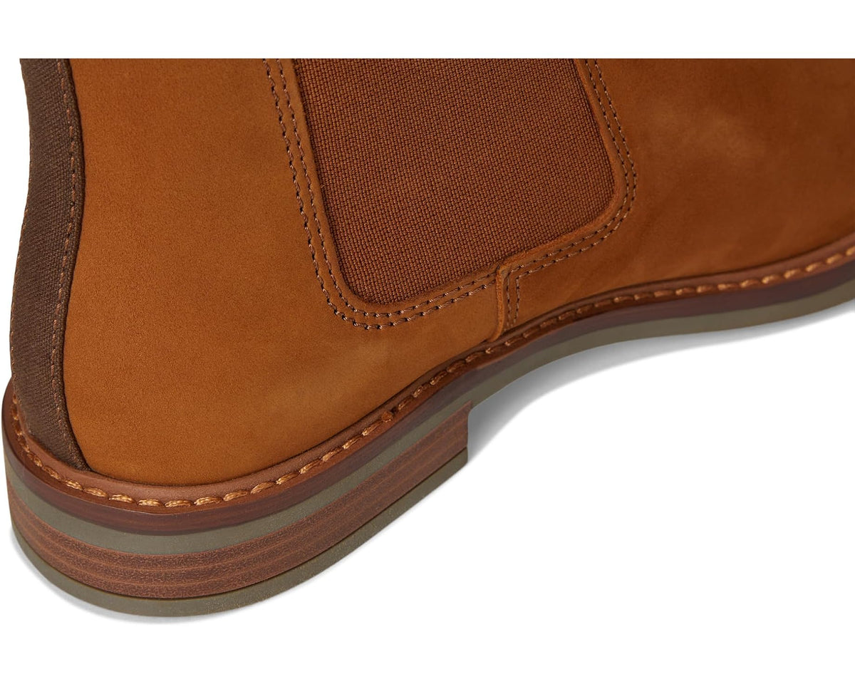 Dark tan suede Chelsea boot with contrast welt stitching along rubber sole