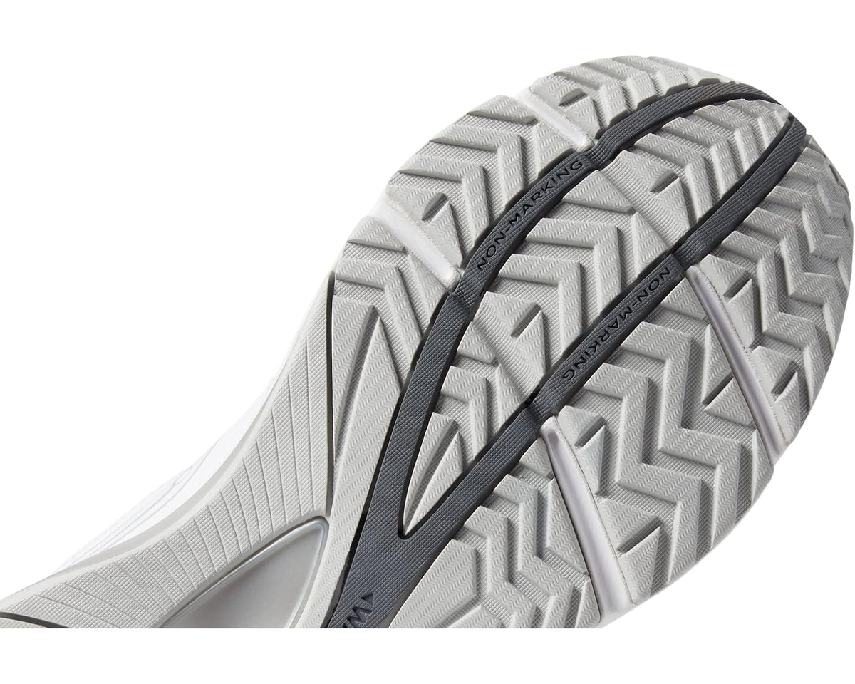 White outsole underside of walking sneaker with textured tread and black stripe