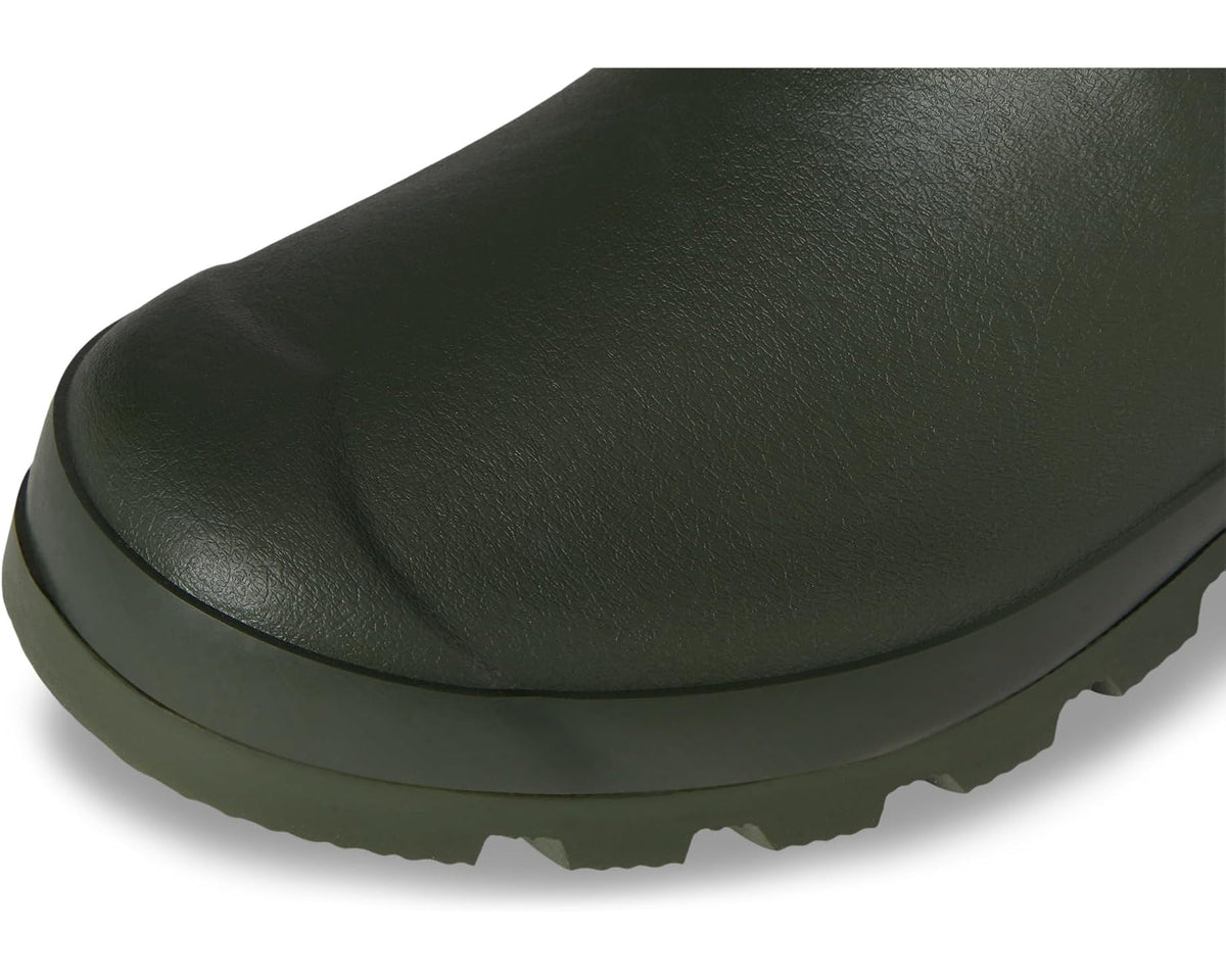 Olive green wellington boot toe with textured traction sole and thick heel