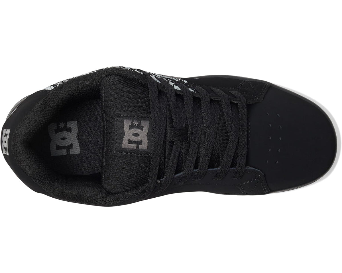 Black lace-up skate sneakers with DC logo on tongue and side print, padded collar.